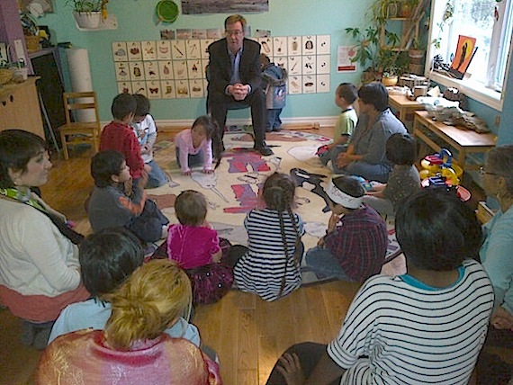 Jim Watson, mayor of Ottawa, meets Nov. 16 with children at the Ottawa Inuit Childrens Centre in Vanier. During his visit, Watson observed Meeka Arnakaq of Pangnirtung as she lit a qulliq and listened to some of the children at the centre throatsing, When the children were asked afterwards if they knew who the mayor was,  one child yelled out 