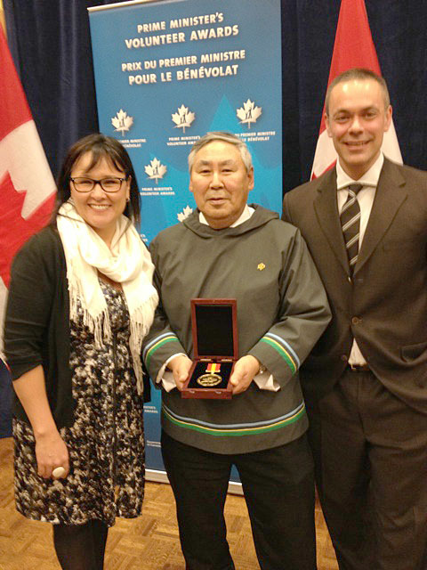 Josie Enuaraq, chair of the Ilisaqsivik Society’s board of directors, and Jake Gearheard, the group’s executive director, with Nunavut MP Leona Aglukkaq Dec. 14, following a ceremony during which Prime Minister Stephen Harper presented Ilisaqsivik with a volunteer award for social innovation. (PHOTO COURTESY OF SHARI GEARHEARD)