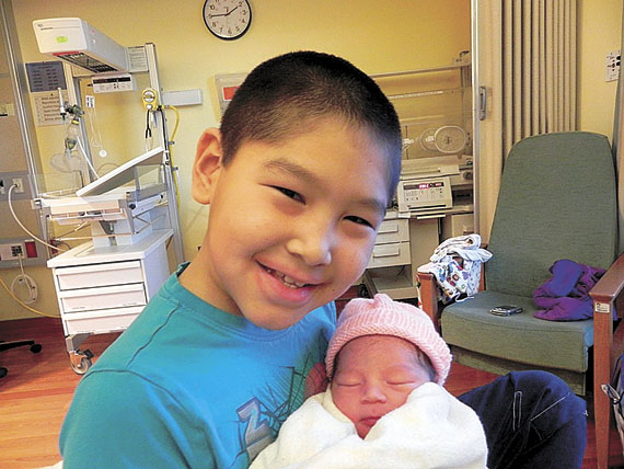 Allyson's brother, eight-year-old Lazarus Aqatsiaq, was happy to meet his new sister, who was born in the early morning hours of Jan. 1 at the Qikiqtani General Hospital. (PHOTO COURTESY OF TRACY AQATSIAQ)
