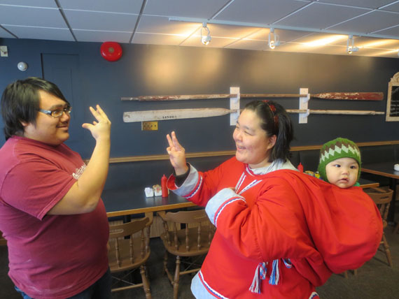 Clayton Ungungai of Baker Lake, who is now studying in Ottawa at Algonquin College, signs to Molly Ugjuk of Rankin Inlet. The two were among the participants who attended a workshop on the Inuit Sign Language last week in Rankin Inlet. Read more about the workshop later on Nunatsiaqonline.ca. (PHOTO COURTESY OF J. MACDOUGALL)