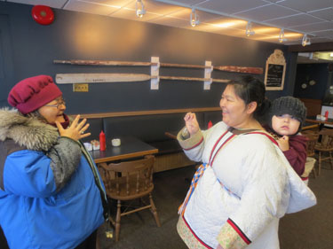 Louisa Nanooklook of Rankin Inlet, who is deaf, speaks in Inuit Sign Language to her daughter Joanne Quinangnaq, also of Rankin Inlet, who is not deaf. (PHOTO COURTESY OF J. MACDOUGALL)
