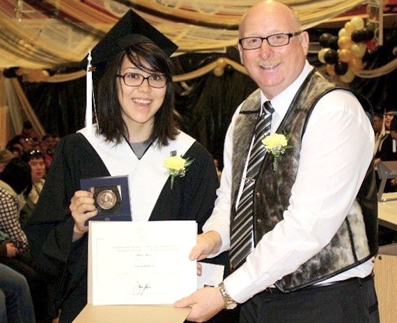 Rebecca Anderson, the recipient of the Governor General award for academic excellence at Rankin Inlet's Maani Ulujuk Ilinniarvik for 2011-12, holds her medal and certificate next to principal Jesse Payne last August. (FILE PHOTO)

