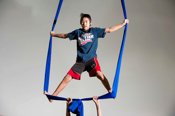 Theoron Etok,13, of Ulluriaq School in Kangiqsualujjuaq, works out on the silks during a workshop led by a crew from the Cirqiniq social circus program, run by the Kativik Regional Government and the Cirque du Soleil. Cirqiniq coaches Marsha Kennington and Jon Burtt will work with kids aged 14 and older. At the end of next week, they'll put on a show for the community. Cirqiniq will visit Kangirsuk Feb. 17. (PHOTO BY PASCAL POULIN)