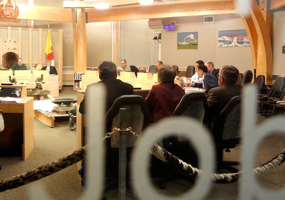 Seen through the window of the Nunavut assembly chamber, David Akeeagok, Nunavut's chief negotiator for devolution, Nunavut Premier Eva Aariak and Dan Vandermeulen, deputy minister of Executive and Intergovernmental Affairs, respond to MLAs' questions about the progress of devolution March 12 during committee of the whole's scrutiny of the intergovernmental affairs unit. Read more about Nunavut and devolution on Nunatsiaqonline.ca. (PHOTO BY JANE GEORGE)