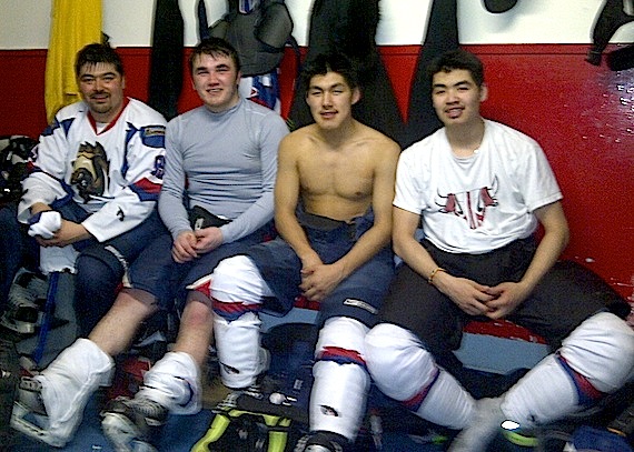 Kuujjuaq Umimmak players start packing it in on March 24 after their fourth and final game of a weekend series they played in Rankin Inlet, following an 8-4 loss at the hands of the home team. Charlie Tukkiapik, second from left, was second star of the game. Teammates Larry Snowball and Putulik Tayara are on the right and Edward Watkins at left. (PHOTO COURTESY OF J. GRENIER)