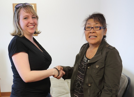 Tara Rutherford, president of the local Nunavut Employees Union in Cambridge Bay, shakes hands with member Iona Maksagak April 24 at an NEU meet-and-greet at the community's NEU office. The goal: to recruit more members for the union. The NEU will hold another open house April 27 from 11 a.m. to 3 p.m. at its office on Omingmak St., where coffee, tea and light snacks will be served. (PHOTO BY RED SUN PRODUCTIONS)
 