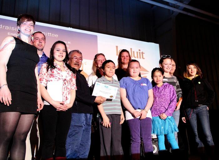 Volunteers with the Iqaluit Reach campaign accepted an award for volunteer appreciation from Coun. Kenny Bell, Coun. Simon Nattaq and Mayor John Graham, at the curling rink April 26 during the city's volunteer appreciation awards ceremony. (PHOTO BY SAMANTHA DAWSON)