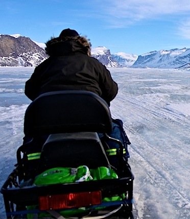 Joavee Alivaktuk from Alivaktuk Outfitting drives his snowmobile towards the entrance to Auyuittuq National Park. But heading out on the Pangnirtung fiord sea ice is getting dangerous, Parks Canada said April 11. (PHOTO BY SARAH MCMAHON)