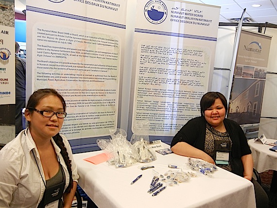 Robin Ikkutisluk and Megan Porter, both of Gjoa Haven, are at the Nunavut Water Board's booth in the Nunavut Mining Symposium's trade show April 10. Read more about mining in Nunavut on Nunatsiaqonline.ca. (PHOTO BY SAMANTHA DAWSON)