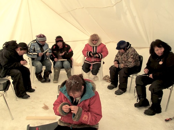 Participants at a carving workshop in Nain, Labrador learn how to make jewelry. 