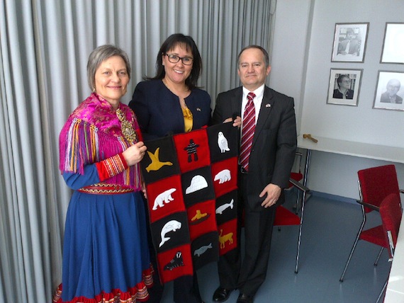 Nunavut MP Leona Aglukkaq, also Canada's Arctic Council minister, presents a wall hanging from Arviat to Anni-Siiri Länsman, director of the University of Oulu’s Giellagas Institute for Saami language and culture (to the right, Christopher Shapardanov, Canada’s ambassador to Finland). Aglukkaq visited Finland last week after the May 15 Arctic Council meeting in Kiruna, Sweden, where she accepted the chairmanship of the Arctic Council for Canada. In Oulu, Aglukkaq also met with local university officials and visited the Oulu Mining School, where a news release said she spoke with representatives of the local business community and northern researchers about 