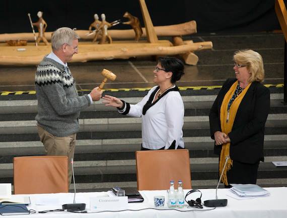 Sweden’s Minister of Foreign Affairs Carl Bildt hands over the ceremonial gavel to Nunavut MP Leona Aglukkaq, Canada's minister responsible for the Arctic Council, May 15 at the Arctic Council ministerial meeting in Kiruna, Sweden. That marked the transfer of chairmanship of the Arctic Council to Canada. (PHOTO BY MARTINA HUBER/ REGERINGSKANSLIET)