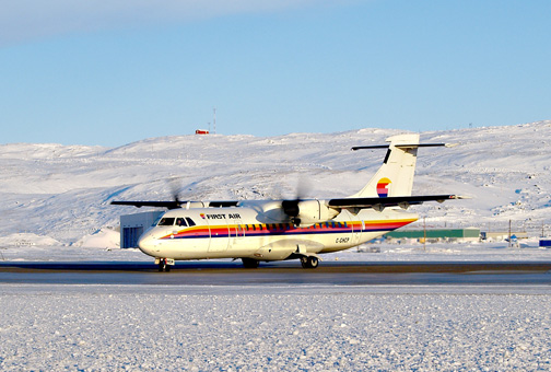 A First Air ATR at the Iqaluit airport. The Air Line Pilots Association International will hold a conference in Ottawa May 29, with representatives from government and the airline industry, to discuss the challenges of aviation in the Arctic, including safety issues. (FILE PHOTO)