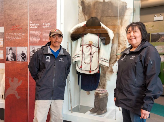 Jessie Baron, at the right, an administrative technician at Kuururjuaq provincial park in Kangiqsualujjuaq, and park director Charlie Munick stand next to a display on traditional clothing in Nunavik — part of an award-winning exhibit at the park's interpretive centre. Read more on Nunatsiaqonline.ca. (PHOTO BY PASCAL POULIN)
