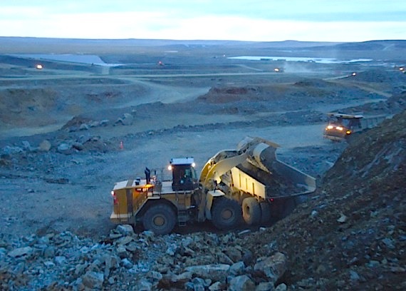 Trucks move ore from an open pit at the site of Canadian Royalties' Nunavik Nickel mine. (PHOTO COURTESY OF CANADIAN ROYALTIES)