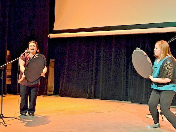 Drum-dancers Karin Kettler, at left, who works for the Kativik Regional Government in Nunavik, and Sarah Jancke, who works for the Kitikmeot Inuit Association in Cambridge Bay, take to the stage at the Katittavik Town Hall in Kuujjuaq June 3 during the community's 