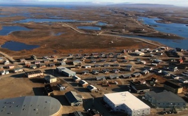 In this photo from the CHARS community consultation document prepared for Cambridge Bay, you can see the site for the research facility to the back of the community. 