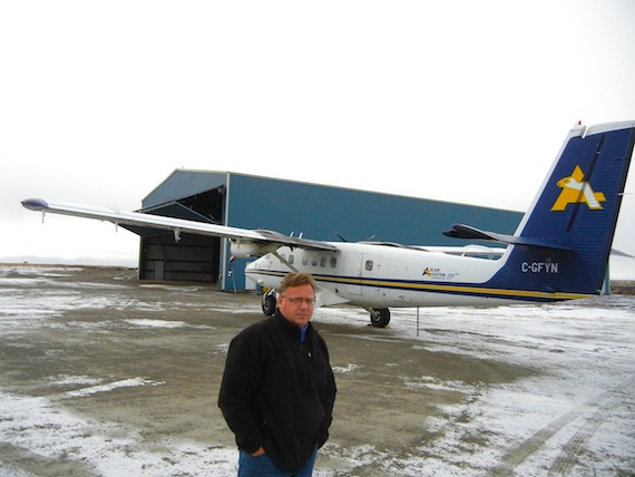 René Laserich of Adlair Aviation Ltd., the Cambridge Bay airline his bush pilot father started, stands in October 2012 in front of one of the company's two hangars at the Cambridge Bay airport, which will now be used by Nolinor as well. (FILE PHOTO)