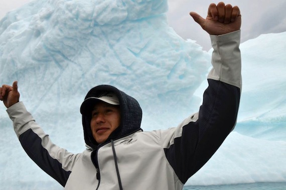 NHL player Jordin Tootoo stands in front of an iceberg in Qikiqtarjuaq July 27. Tootoo visited Kimmirut, Qikiqtarjuaq, Clyde River, Cape Dorset and Sanikiluaq this past week as part of the 2013 Nunasi Corp. Community Tour. You can see more photos from the tour on the Facebook page of Nunatsiaq News. (PHOTOS BY DAVID MURPHY) 
