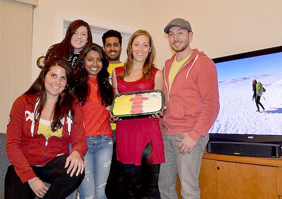 Iqaluit fans of the CTV television show, the Amazing Race, dress up in Nunavut colours Aug. 26 to watch the show and enjoy a Nunavut-themed potluck supper, which included caribou, Arctic char and a Nunavut-flag decorated cake. On Aug. 26, the Amazing Race, dedicated a full hour to Nunavut's capital. In the show, competitors work in pairs to complete tasks, and the last team to cross the finish line at a certain location gets kicked out of the competition. In the Iqaluit episode, competitors were asked to find an Inuktitut translator, build an igloo and eat maktaq.From left to right, Erika Marteleira, Sam Gardner, Anubha Momin, Justin Hack, Sara Statham and Lou Kamermans. CTV's Amazing Race Canada is the most-watched English-language television show in the country right now, attracting nearly 2.9 million viewers to its Aug. 12 broadcast. (PHOTO BY DAVID MURPHY)
