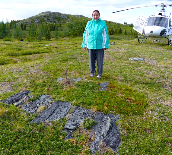 Maggie Gordon stands next to a gravesite Aug. 14, thought to be that of her sister, Penina, who died in 1932. (PHOTO BY ALLEN GORDON)