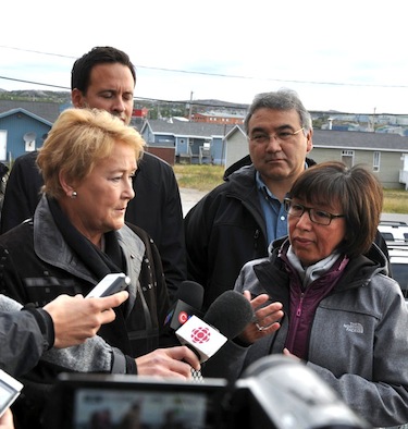 Quebec Premier Pauline Marois listens Sept. 13 as Kativik Regional Government chairperson Maggie Emudluk responds to questions at a news conference in Kuujjuaq. Makivik Corp. president Jobie Tukkiapik (back right) looks on. (PHOTO BY SARAH ROGERS)