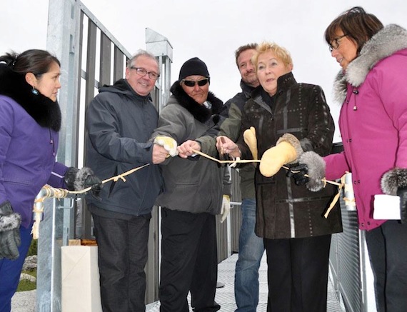 Quebec Premier Pauline Marois, second from right, and Nunavik leaders help cut the ribbon Sept. 13 at the official opening ceremony for the Kuururjuaq provincial park interpretation centre in Kangiqsualujjuaq. Marois spent the day visiting the different places in the community, wrapping up her visit with a community feast. Read more late about her Nunavik tour on Nunatsiaqonline.ca. (PHOTO BY GILLIAN WARNER)