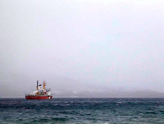 The CCGS Henry Larsen endures snowy, windy weather in Arctic Bay Sept. 3. The icebreaker is named after Henry Larsen, the commander of the RCMP patrol vessel St. Roch, which was the first vessel to traverse the Northwest Passage in a single season in 1944. (PHOTO BY CLARE KINES)
