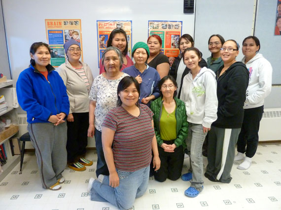 Thirteen adult students in Taloyoak have just completed the first in a series of courses offered by Nunavut Arctic College’s Early Childhood Education certificate program. The students will study child development, Inuit child-rearing, safety, nutrition, and childcare centre curriculum. The students hope the training will help them find work caring for young children when a new daycare centre opens in their community some time next year. From left to right: Jeannie Pauloosie, Mona Totalik, Sally Oleektalik, Sarah Uquqtuq, Jennifer Karoo, Dora Quayaut, Vata Pauloosie, Alice Quamaut, Rebecca Karoo, Leah Eckalook, Shawna Sungnaruk, Kimberley Jayko, and Yolande Aupalu. (PHOTO COURTESY OF LORNA DOUBT)
       