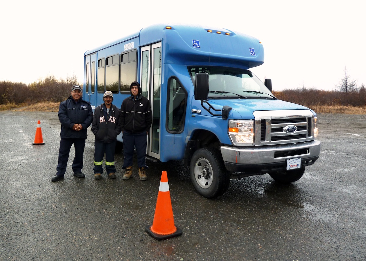 Kuujjuaq’s brand new town bus arrived by sealift this month. Gérard Tondreau, at left, is an instructor from a Quebec transport training centre who is training potential drivers such as George Tukkiapik and Sailasie Gordon, right, part of a group of eight initial trainees. The municipality hopes to have the new bus service in operation sometime in November. (PHOTO BY ISABELLE DUBOIS)