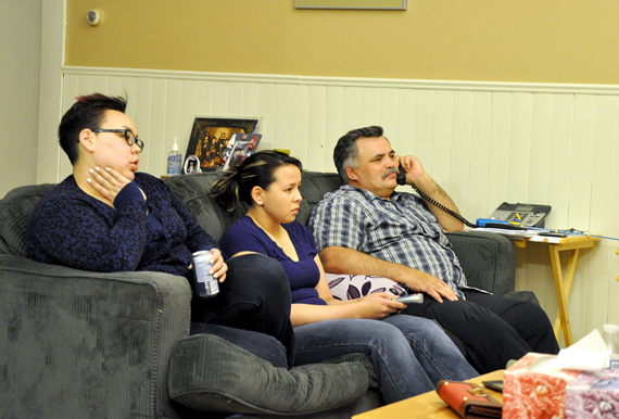 At home with his family in Rankin Inlet on the evening of Oct. 28, Lorne Kusugak watches televised election coverage. Kusugak, who hoped to be re-elected in Rankin Inlet South, now faces a judicial recount after a 172-172 tie with the riding's only other candidate, Alexander Sammurtok. (PHOTO BY SARAH ROGERS)