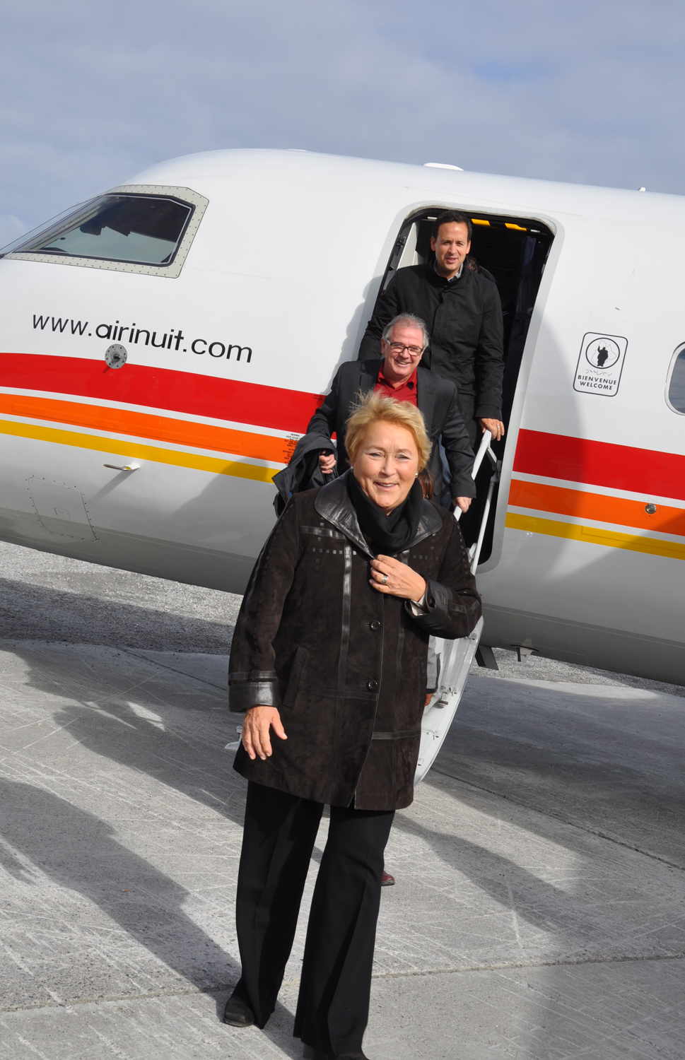 Quebec premier Pauline Marois steps off a plane in Kangiqsualujjuaq in September, followed by Ungava MNA Luc Ferland and Alexandre Cloutier, Quebec’s minister responsible for the Nord-du-Quebec region. The province is calling on the federal government to fulfill its treaty obligations and help Nunavik build the 899 units it needs to end its housing crisis. (PHOTO BY SARAH ROGERS)