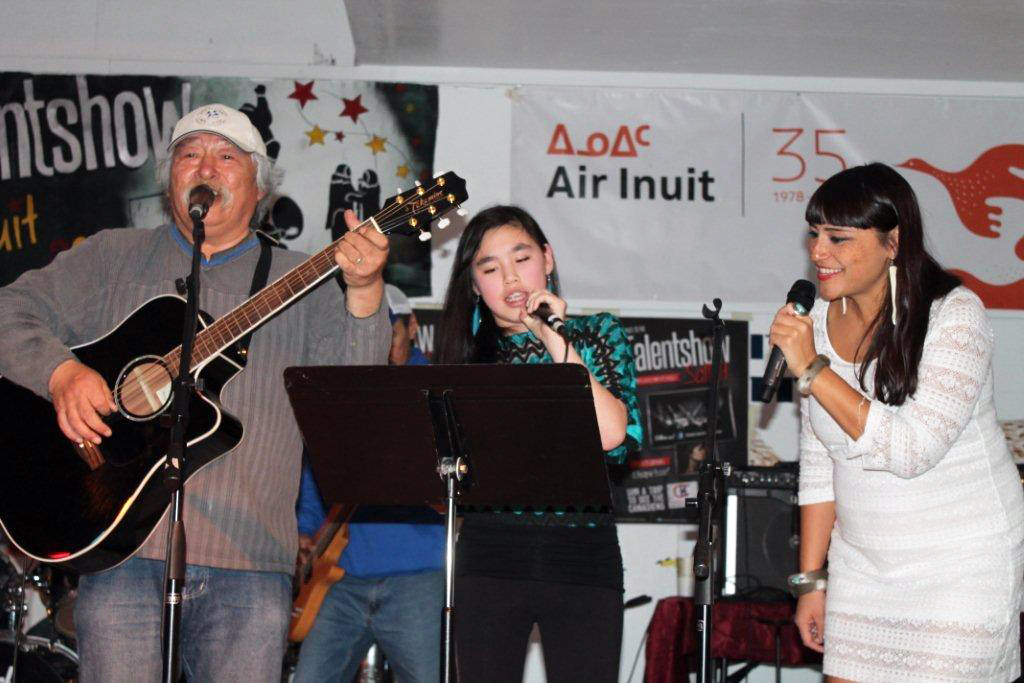 From left, Georges Kakayuk from the Sugluk band, Betsy Shemi Koperqualuk and special guest and singer Elisapie perform at a Salluit talent show Oct. 30. A local youth protection worker helped to coordinate the event, putting together a line-up of performances from local artists, including a guest appearance by Salluit's own Elisapie Isaac. (PHOTO BY EMMANUEL MORIN) 