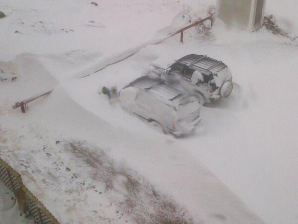 Two cars get buried under a snowdrift in Iqaluit, which is expected to get between 10 to 20 centimetres of snow today, with winds gusting up to 100 km/h. (PHOTO BY KENNY BELL)