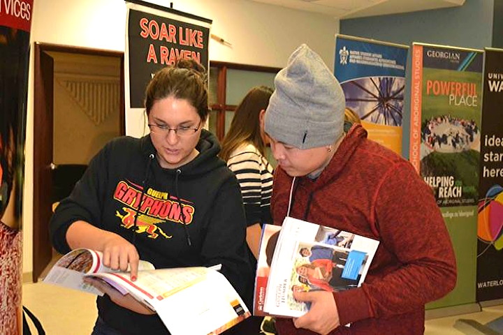Nunavut Sivuniksavut college in Ottawa held its first university fair in November 2013 to help expose students to a variety of possible learning options once they've completed the NS program. A recent alumni survey showed that half of NS graduates go on to further post-secondary institutions. Here Cape Dorset's Jutai Toonoo chats with a representative from the University of Guelph, one of 11 institutions who participated in the fair. Go to the Nunavut Sivuniksavut Facebook page for more photos of the event. (PHOTO COURTESY OF NS)