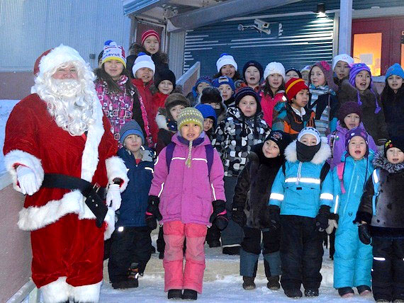 Ron Brodie, bus driver for Hanson Ltd. in Iqaluit, dresses up as Santa for kids at Joamie School on their last day of school before the holidays. Classes resume Jan. 6, 2014. (PHOTO COURTESY OF SONJA LEBLANC)