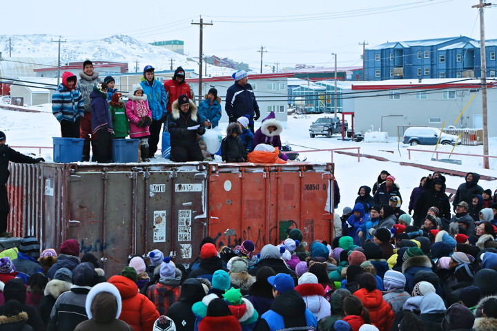 First time harvesters from 2013 celebrated their milestone on new year's day in Iqaluit by tossing candy to family and friends. Those first-time harvesters included: Jerry Papatsie Jr. (polar bear), Patrick Joannie Monpetit (beluga), Lena Sagiatok (ptarmigan), Eepa Sagiatok (ptarmigan), Nuyalia Ishulutak (arctic char with a kakivak), Grace Nowdluk (arctic char), Ian Peter (ringed seal), Miya Nadrowski (arctic char and arctic hare), Jeremy Nadrowski (arctic char), Emma Nadrowski (arctic char), Samuel Nowdluk (ringed seal and eider duck), Michael Nowdluk (beluga) and lastly, Pauloosie and Jimmy Davidee (no animal specified). (PHOTO BY SARAH MCMAHON)