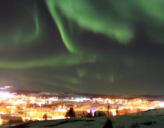 The northern lights danced above Kuujjuaq in the early hours of 2014, while residents rang in the New Year below. Northerners across the world have been enjoying vibrant light displays this week; the aurora forecast calls for active skies Jan. 2 and 3. (PHOTO  BY GILLES BOUTIN) 
