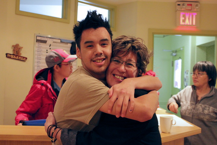 Counsellor and Indian Residential School co-ordinator Meeka Papatsie hugs one of the young clients who has just come through the six-week trauma and addiction program at Mamisarvik Healing Centre in Ottawa. (PHOTO BY LISA GREGOIRE)