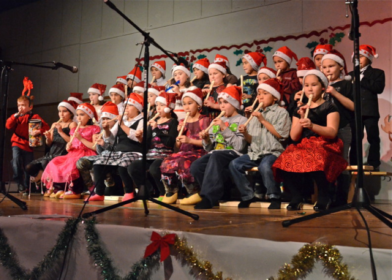 Grade 3 students from Pitakallak School in Kuujjuaq perform Christmas songs on the recorder (and drum!) during a concert at Jaanimmarik School Dec. 18 which featured performances by children from both schools. (PHOTO BY ISABELLE DUBOIS)