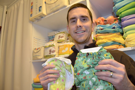 Iqaluit resident and businessman Brad Chambers holds up some of his wares: colourful, cloth diapers. Chambers and his wife recently launched their business Arctic Cotton from their Apex home, making it the only reusable diaper store in Nunavut. Read more about the diapers at Nunatsiaqonline.ca. (PHOTO BY DAVID MURPHY) 
