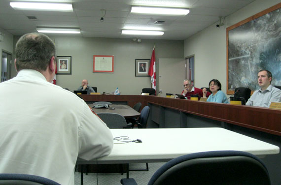 Iqaluit’s chief of municipal enforcement, Kevin Sloboda, takes questions from city councillors, Jan. 9, the opening day of council’s review of the city’s proposed 2014 budget. (PHOTO BY PETER VARGA)