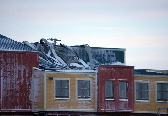 Metal sheeting on the roof of École des Trois Soleils in Iqaluit was mangled during the violent blizzard in Iqaluit Jan. 7. (PHOTO BY ADAMIE SAKEETA) 
