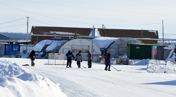 Young Kuujjuammiut take advantage of the sunshine and longer daylight hours to start an afternoon game of street hockey. Nunavik's largest community has enjoyed clear skies and frosty temperatures this week. (PHOTO BY SARAH ROGERS)