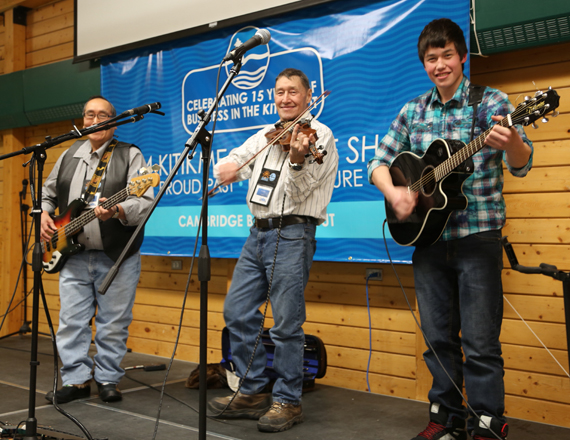 Cambridge Bay musicians David Evalik, Colin Adjun and his son Gustin, entertain a crowd Feb. 10 to kick off this year's Kitikmeot trade show in Cambridge Bay. This is the 15th year anniversary of the trade show, which runs until Feb. 12 at the community's Kiilinik High School. (PHOTO  BY RED SUN PRODUCTIONS) 
