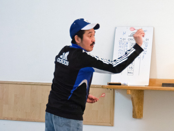 Bernie Atatahak takes aim at a March 22 at the 2nd annual Tim Walsh Memorial Tournament at the Ikaluktutiak Elks Lodge in Cambridge Bay. Players from the Victoria Island Dart League took part to raise money for the Canadian Cancer Society in honour of a former member, Tim Walsh, who died of cancer. (PHOTO BY DENISE LEBLEU IMAGES) 

