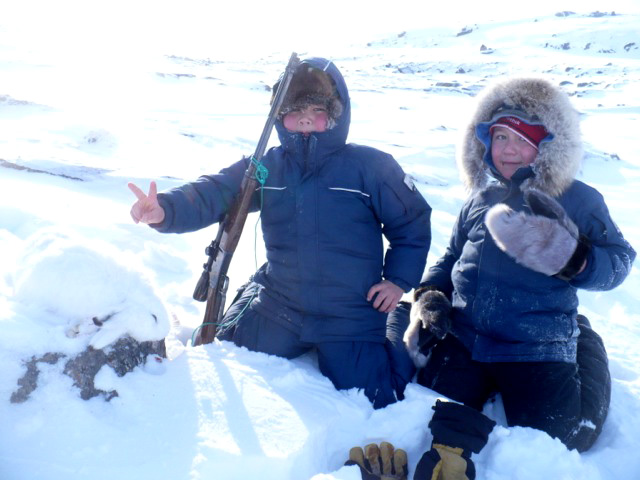 Hunting pals and cousins Kyle and Ryan Kilabuk enjoyed a successful hunting weekend at Burton Bay near Iqaluit. Kyle was happy with his first catch, with a little help from his veteran hunting pal and Ryan trapped his first fox on the same weekend. (PHOTO BY DAVID SERKOAK)