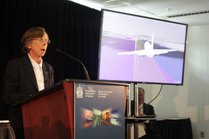 With the help of an animated film, Kathy Fox of the Transportation Safety Board explains how First Air Flight 6560 veered off its proper course — shown in purple — on a trajectory that eventually resulted in a hillside crash roughly a kilometre east of the Resolute Bay runway on Aug. 20, 2011. (PHOTO BY LISA GREGOIRE)