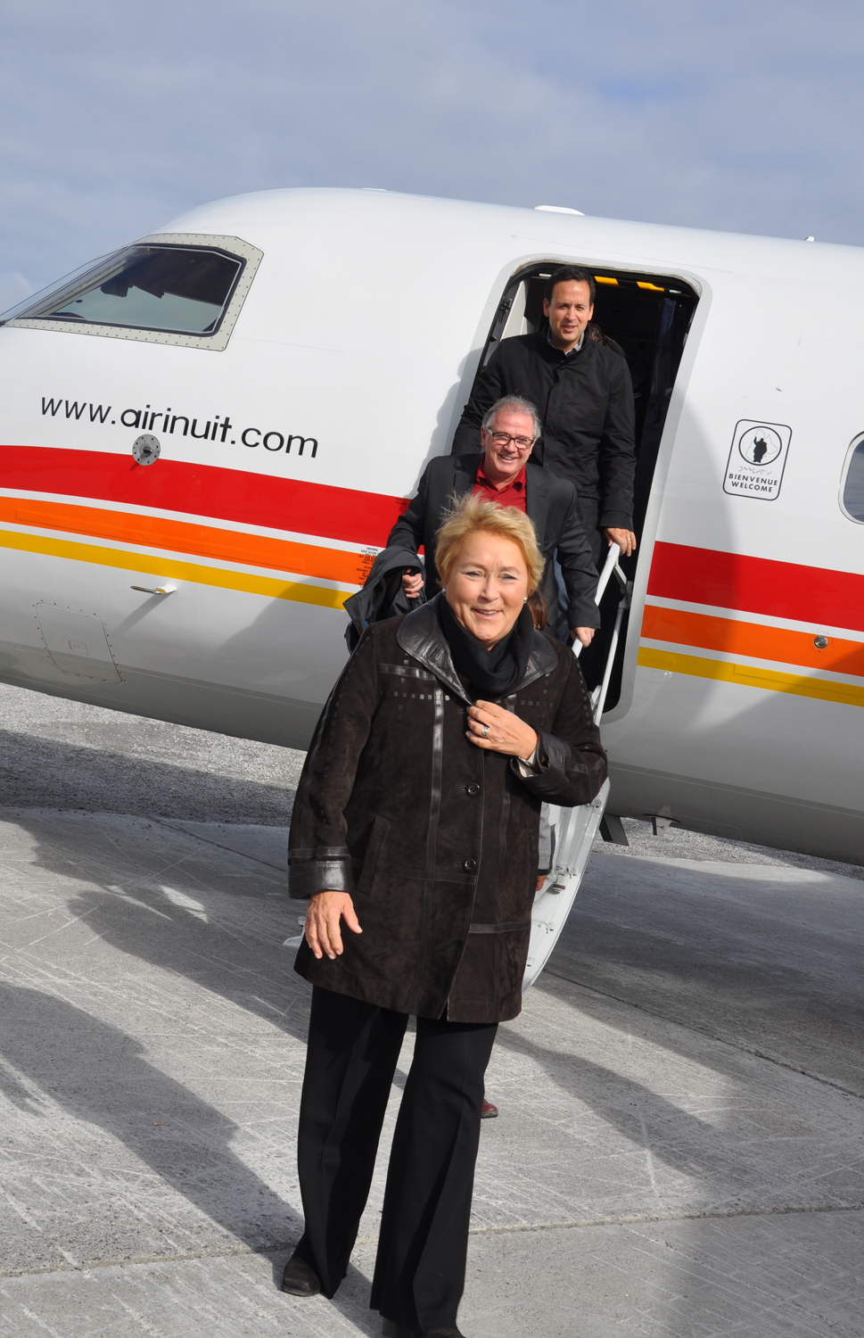 Quebec premier Pauline Marois steps off a plane in Kangiqsualujjuaq during her first official visit to the region last September, followed by Ungava MNA Luc Ferland and Alexandre Cloutier, minister responsible for the Nord-du-Québec region. (FILE PHOTO) 