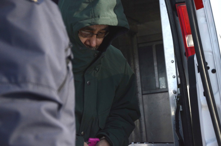 Simeonie Issigaitok, 60, steps out of an RCMP vehicle at the Nunavut Court of Justice March 28, where he was sentenced to two years imprisonment, six years of long-term supervision after that, and deemed a dangerous offender. (PHOTO BY DAVID MURPHY) 